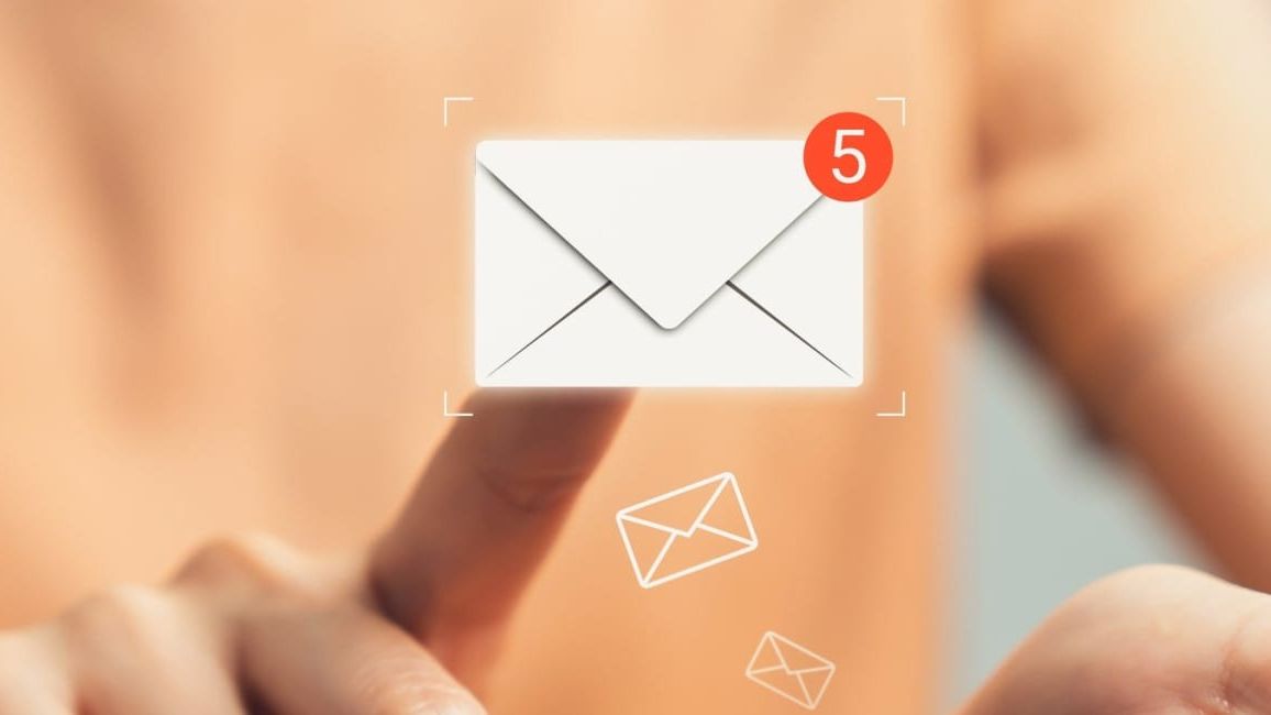 Person tapping on a virtual email icon with a notification badge