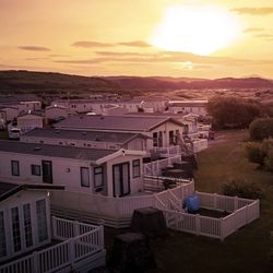 Row of modern mobile homes in a holiday park at sunset