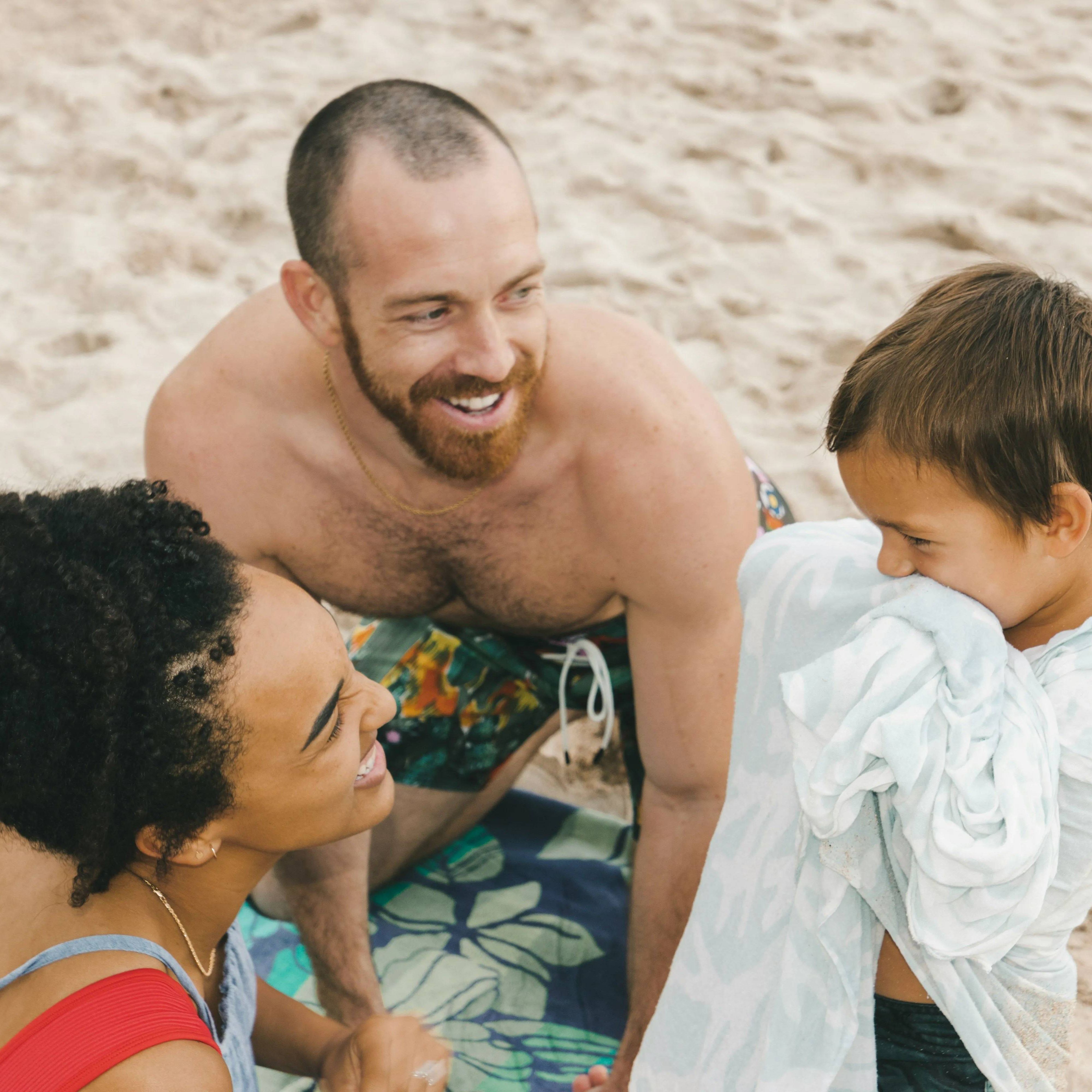Smiling family enjoying time together on the beach