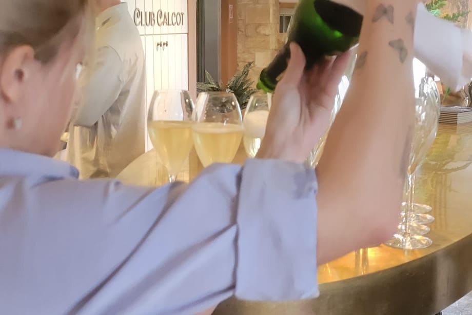 Pouring Taittinger champagne