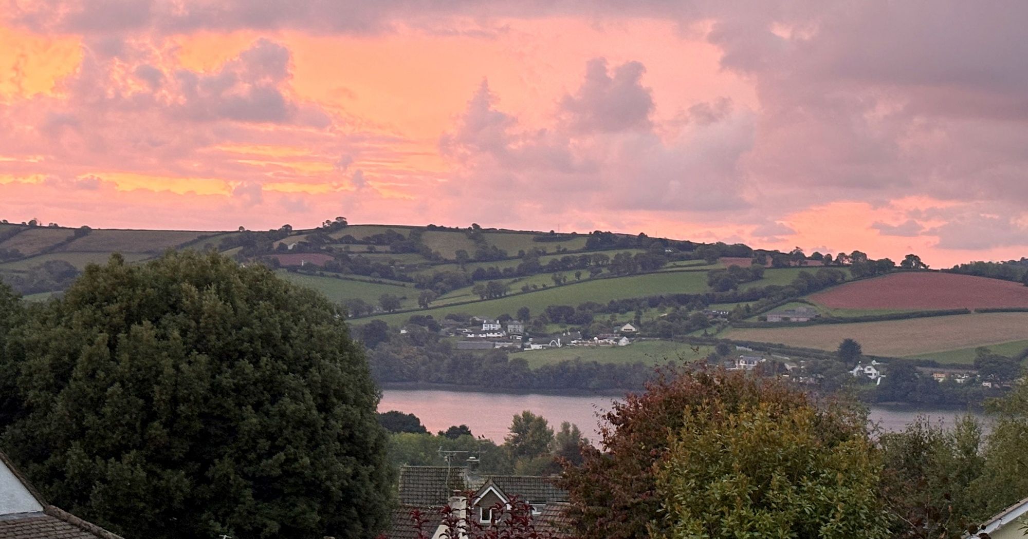 sun setting over river teign