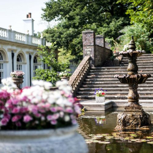 Outside garden area with stairs and fountain