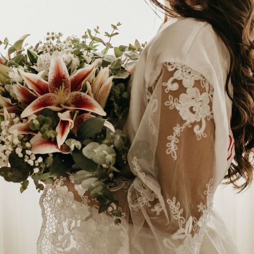 Bride in her wedding gown and her bouquet of flowers
