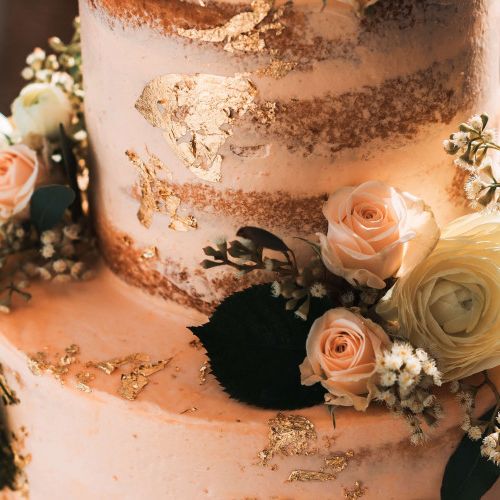 White Naked Wedding Cake with White and Pink Flowers