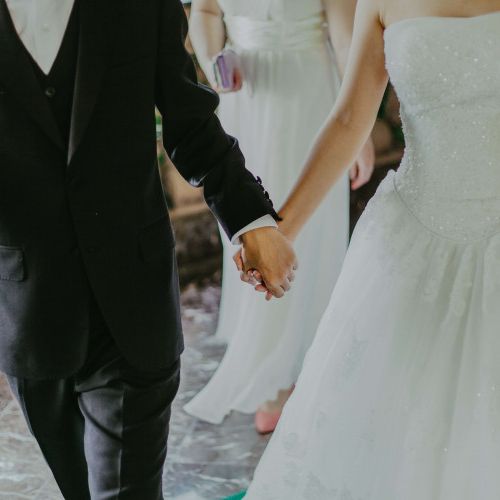 Front View of Bride and Groom walking together