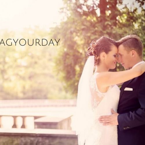 Bride & groom photo on a balcony with #HASHTAGYOURDAY