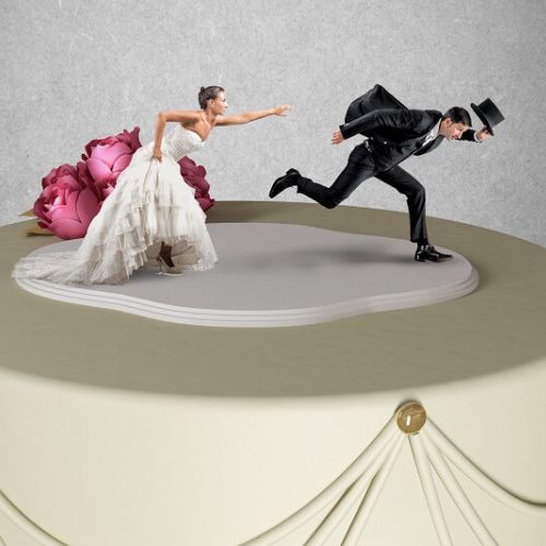 Bride and Groom running away on cake topper
