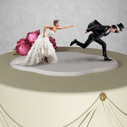 Bride and Groom running away on cake topper