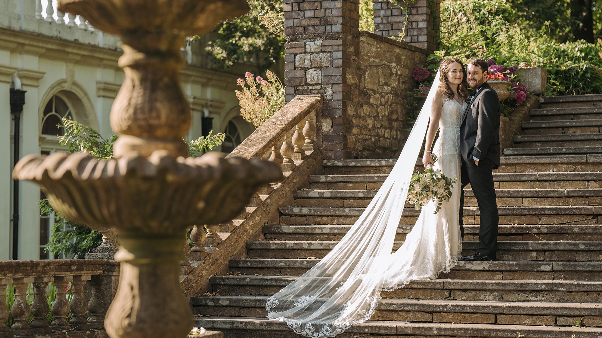 Bride and groom on outside steps