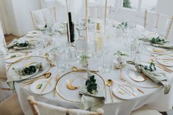 Wedding table set up with gold and white theme