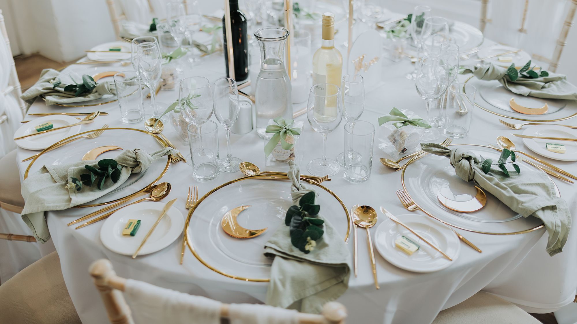Wedding table set up with gold and white theme
