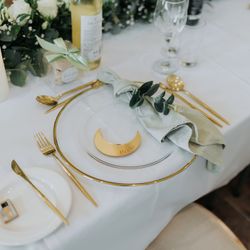 Wedding table set up with gold and white theme