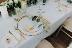 Wedding table set up with gold and white theme