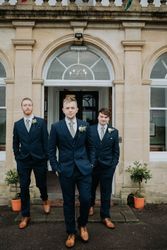 Groomsmen outside hotel