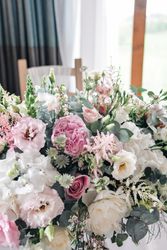Beautiful arrangement of pink, white, and blush flowers with greenery.