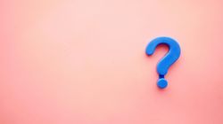 Blue question mark on pink background