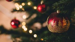 Close-up of Christmas tree decorated with red and gold ornaments and lights