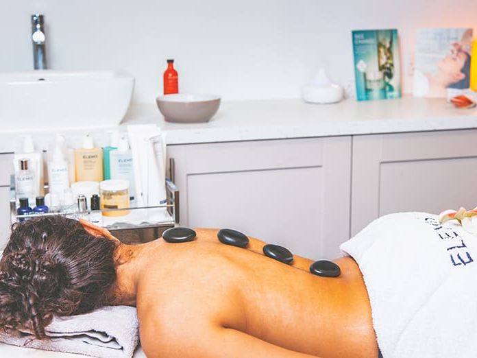 Pebbles on woman's back
