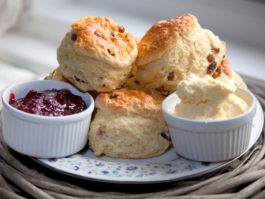Plate of scones with clotted cream and jam