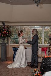 Bride and groom exchanging vows during an indoor wedding ceremony