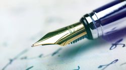 Close-up of a fountain pen writing on paper
