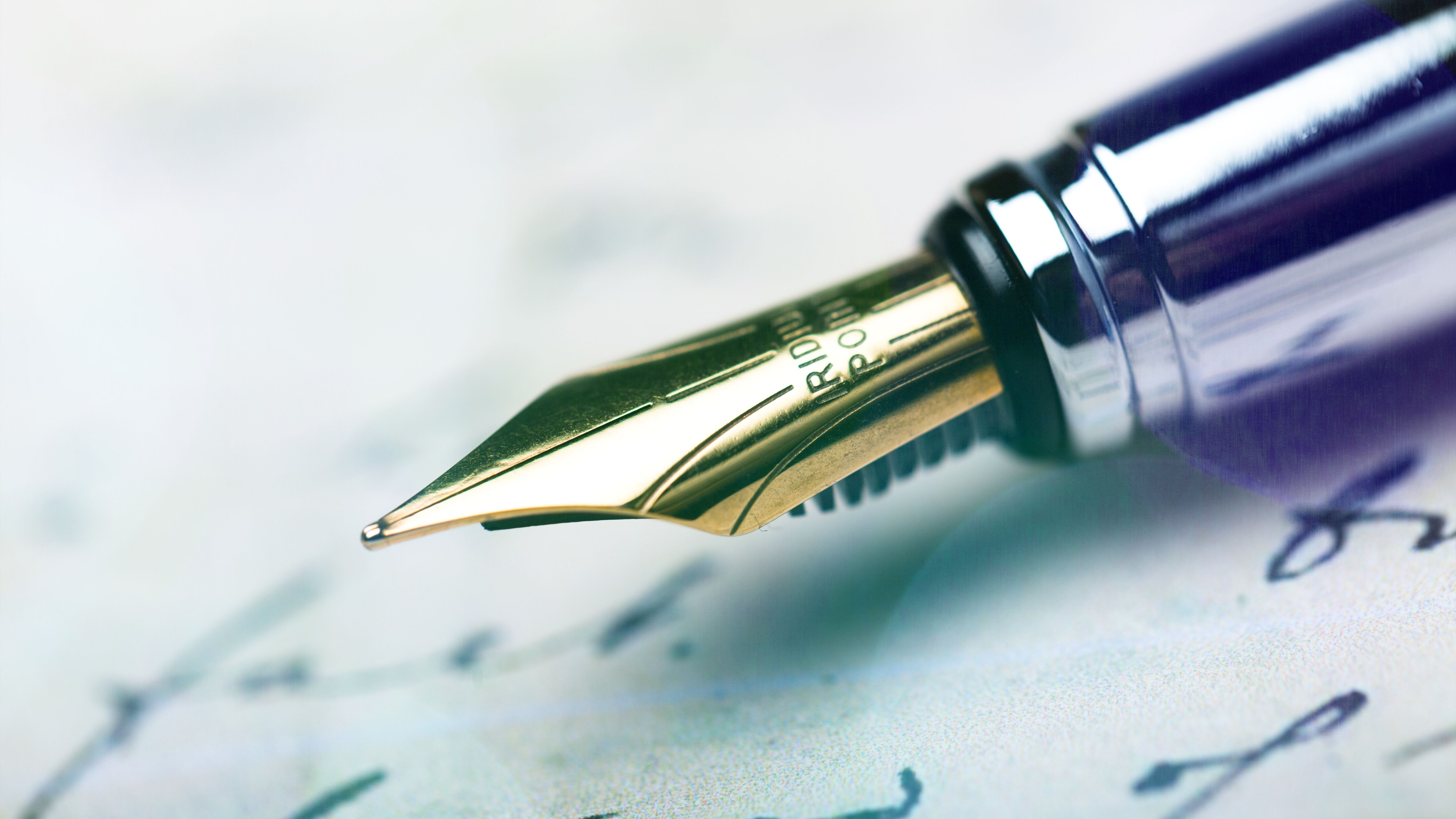Close-up of a fountain pen writing on paper