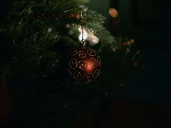 Close-up of a Christmas ornament hanging on a decorated tree