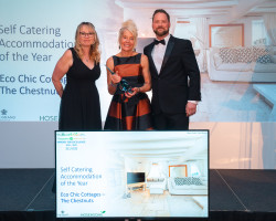 Mary receiving The Beautiful South Award