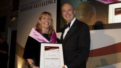 Giles Brandreth presents Chris with a Tourism awards