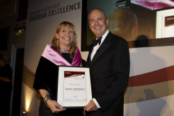 Giles Brandreth presents Chris with a Tourism awards