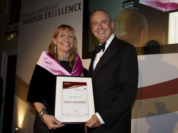 Giles Brandreth presents Chris with a Tourism awards