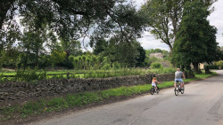 Father and daughter cycling in Shilton
