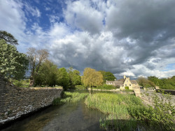 Fairford Mill and stormy sky