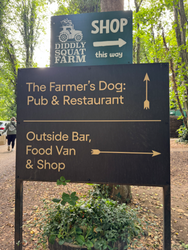 The Farmers dog pub & Diddly Squat shop sign
