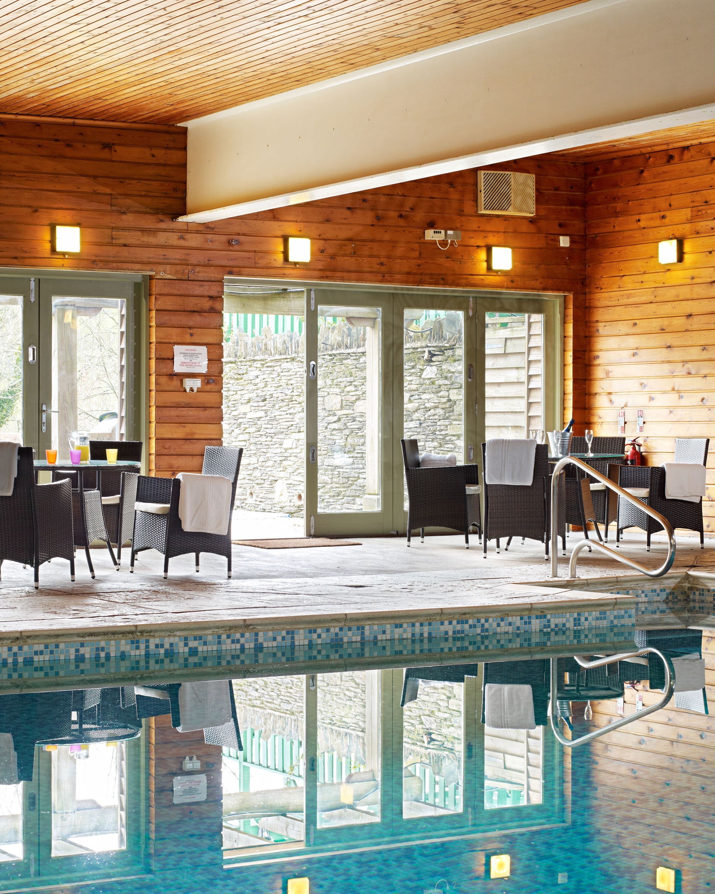 Indoor pool with large glass windows