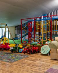 Blay barn with ride on toys, climbing frame and trampoline