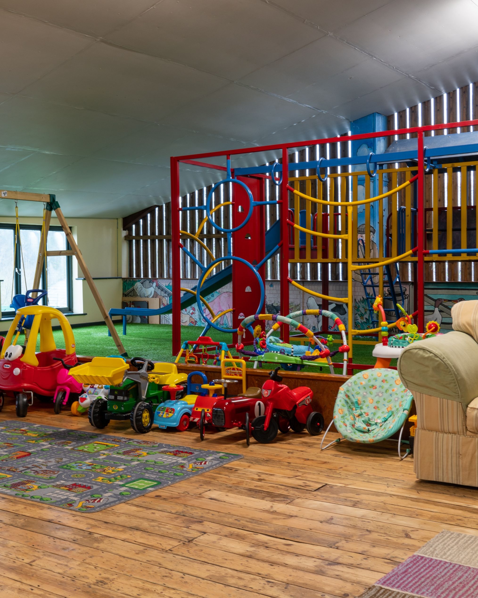 Blay barn with ride on toys, climbing frame and trampoline
