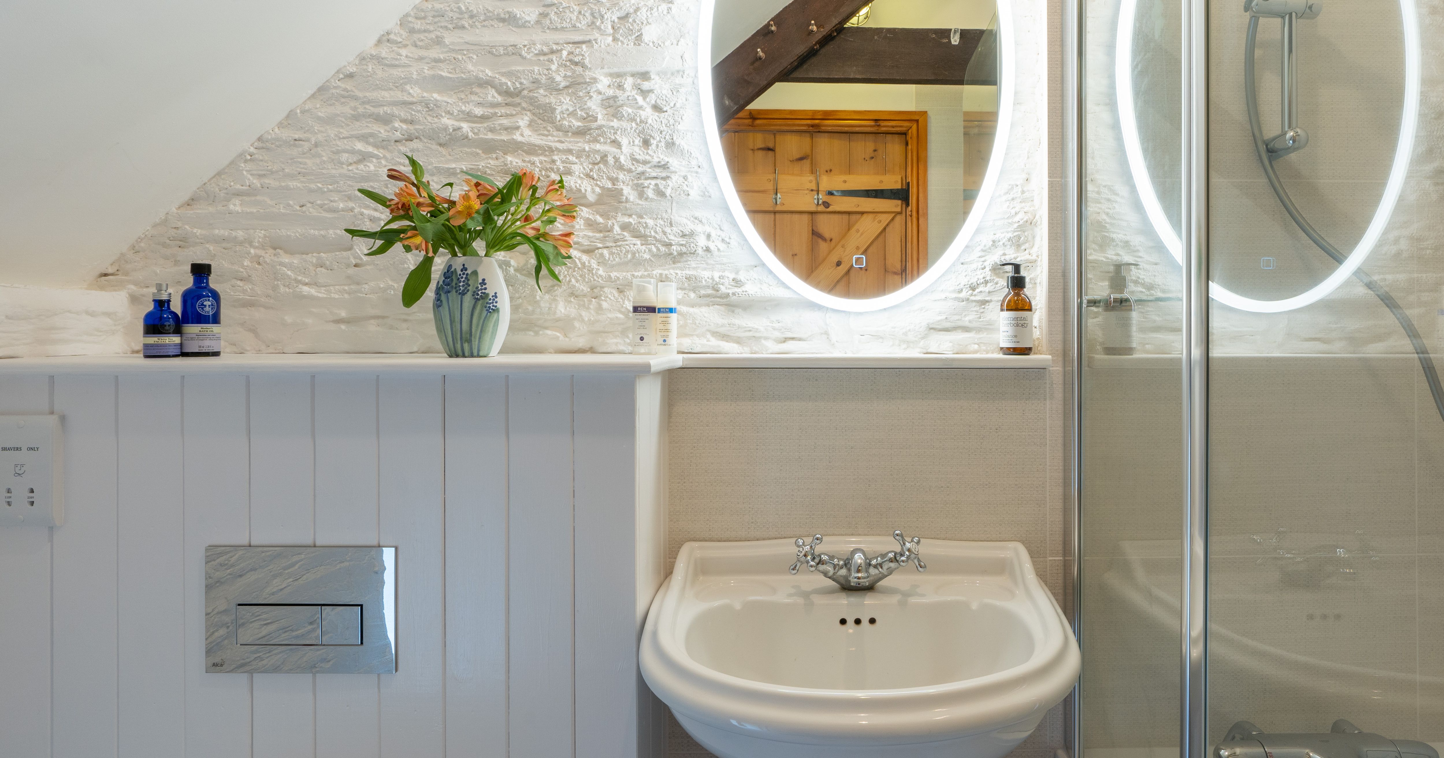 the dairy bathroom with light up mirror
