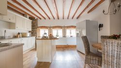 Cartwheel kitchen with exposed beams