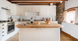 Cartwheel kitchen with exposed beams