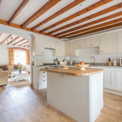 Cartwheel kitchen with exposed beams
