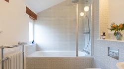 Linhay bathroom with bath over the shower