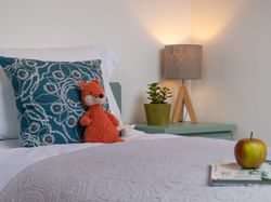 Mangers bedroom with childrens toy on the bed