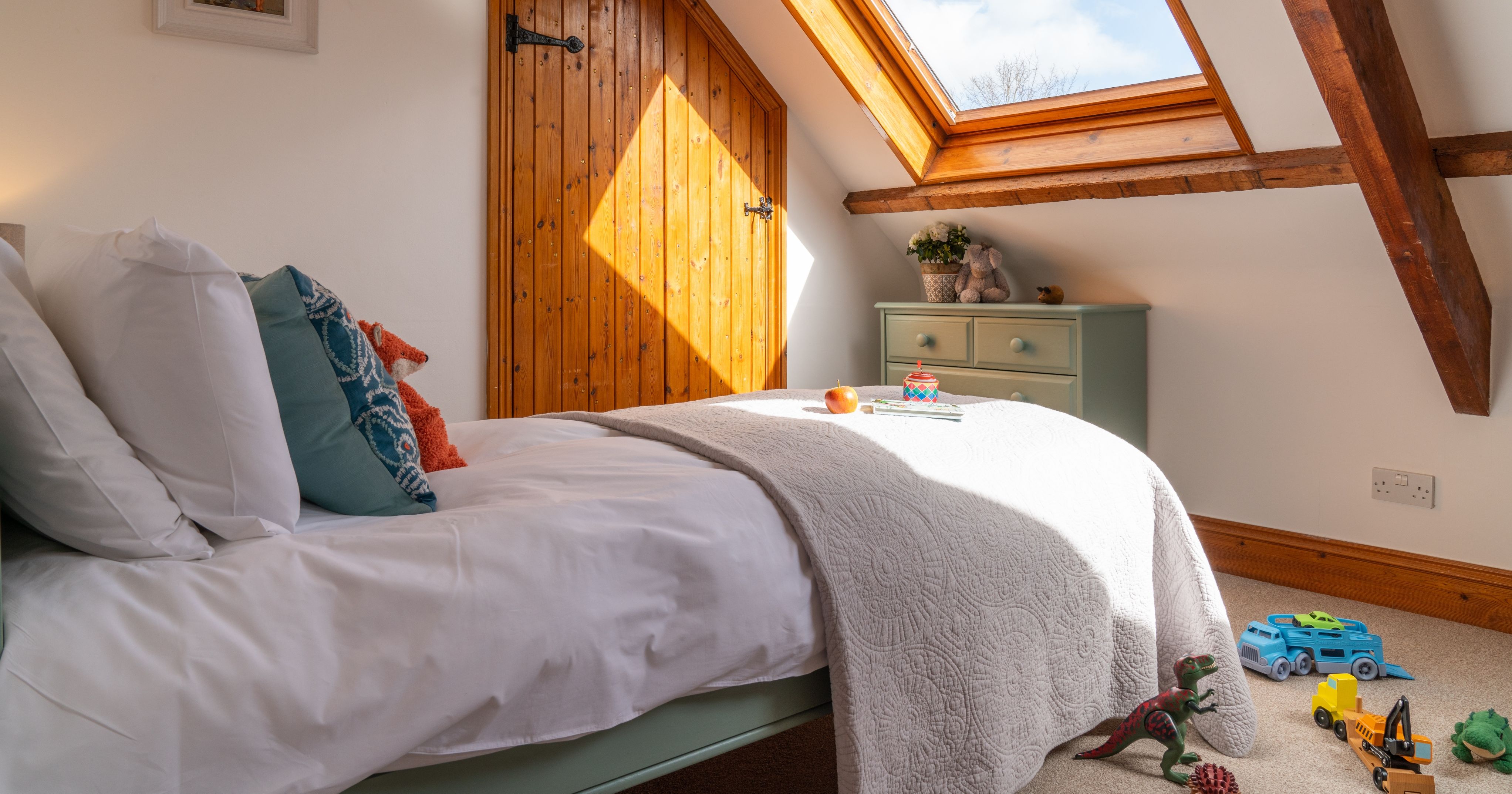 Mangers bedroom with childrens toy on the bed