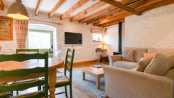 Quarry living area with exposed beams
