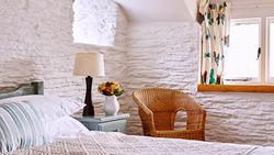 Master bedroom with armchair in the corner