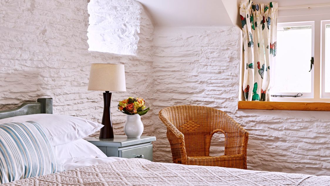 Master bedroom with armchair in the corner