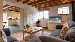 Ducks Nest living area with two sofas and open plan into the kitchen