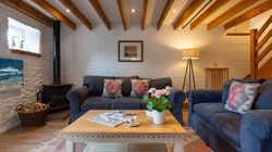 Ducks Nest living room with two sofas and exposed beams