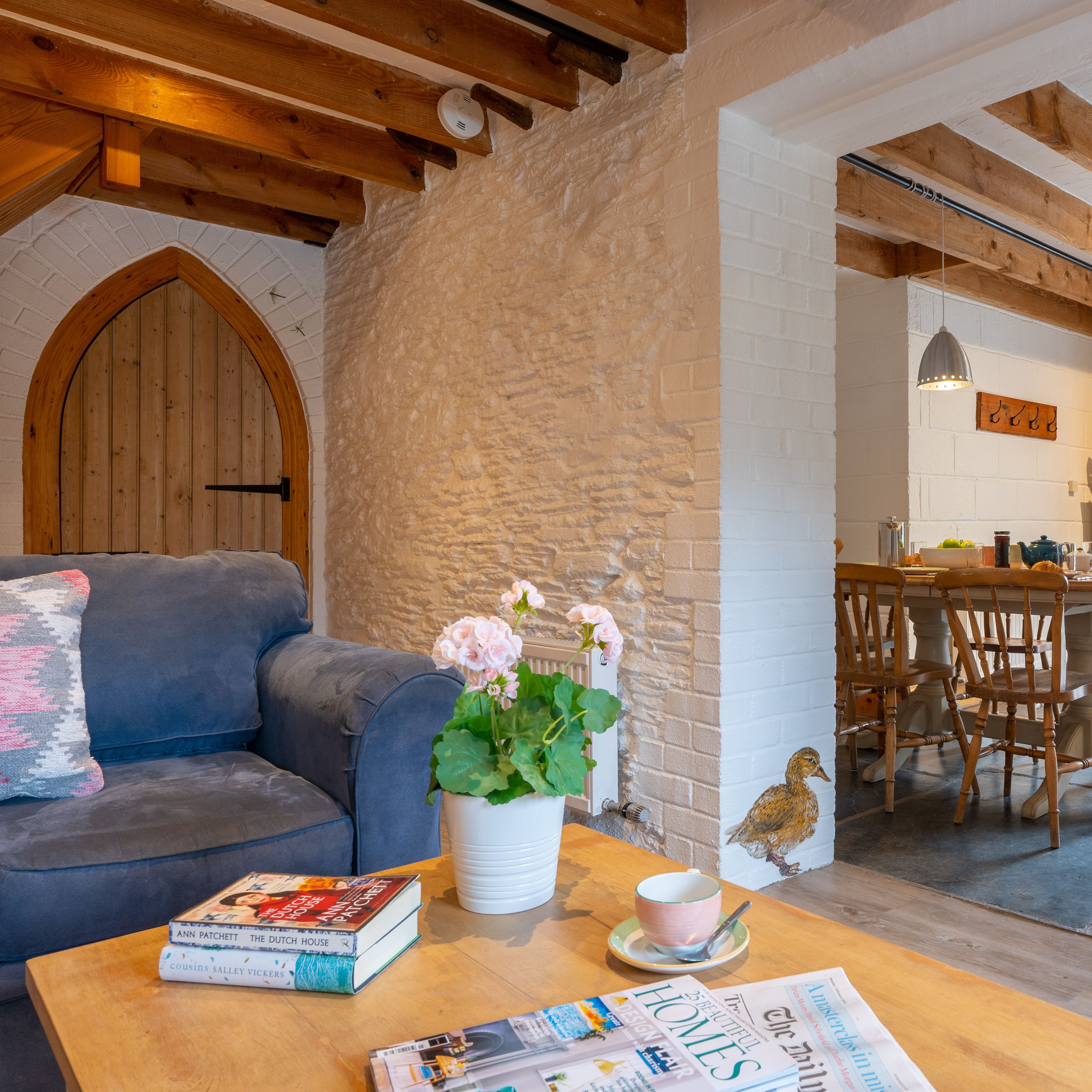 Ducks Nest living area with two sofas and open plan into the kitchen